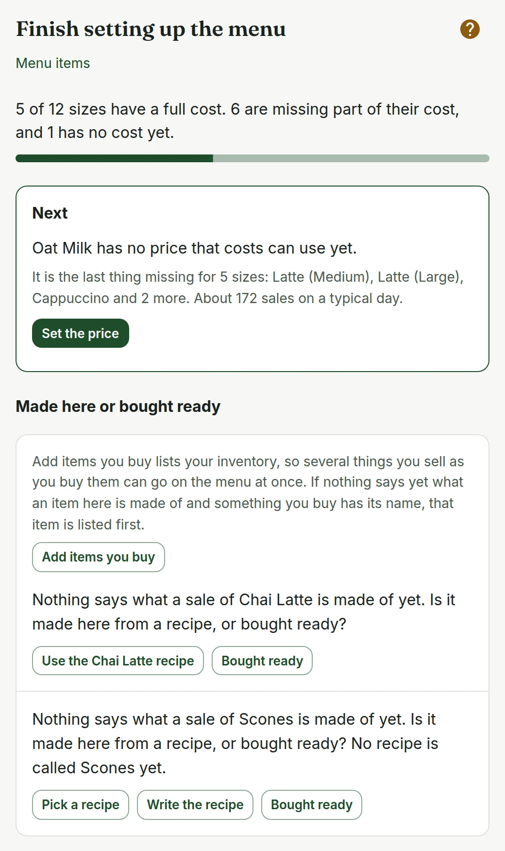 Finish setting up the menu on a phone: 5 of 12 sizes have a full cost, 6 are missing part of their cost and 1 has no cost yet. The Next card says Oat Milk has no price that costs can use yet and that it is the last thing missing for 5 sizes, with Set the price. Below it, two items are asked whether they are made here from a recipe or bought ready, one with Use the Chai Latte recipe.